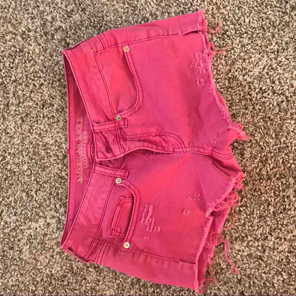 Hot pink distressed AE jean shorts